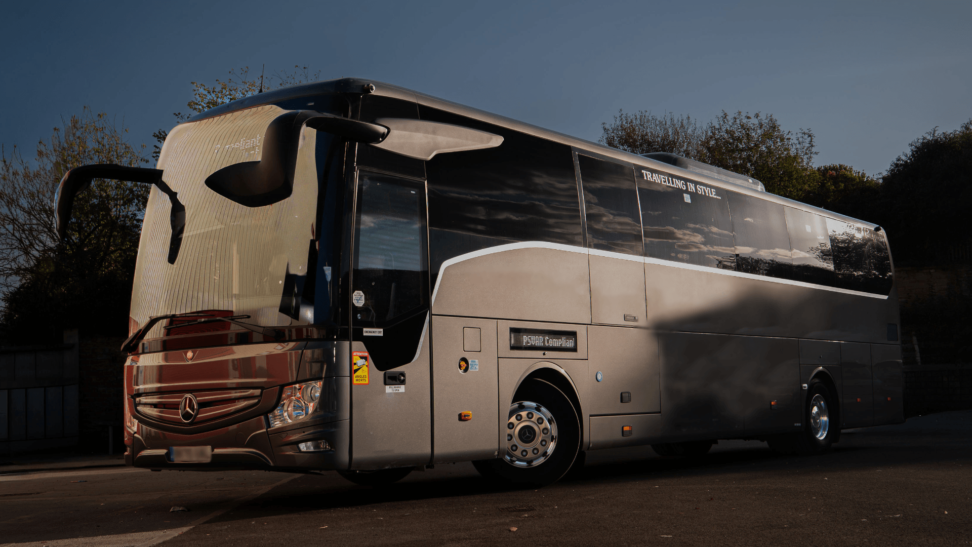 Luxury 70 seater Mercedes Benz coach in grey with customisable heading board.