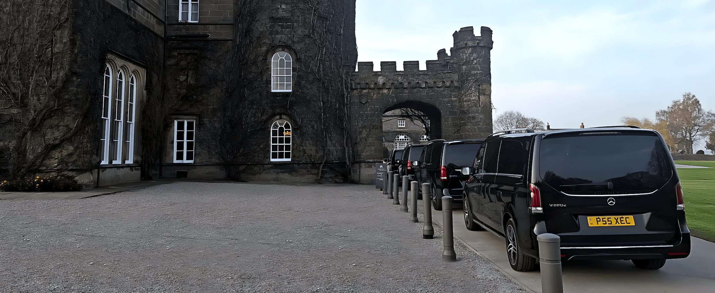 Convoy of Mercedes-Benz V Class MPVs approaching a hotel event venue in Ripon.