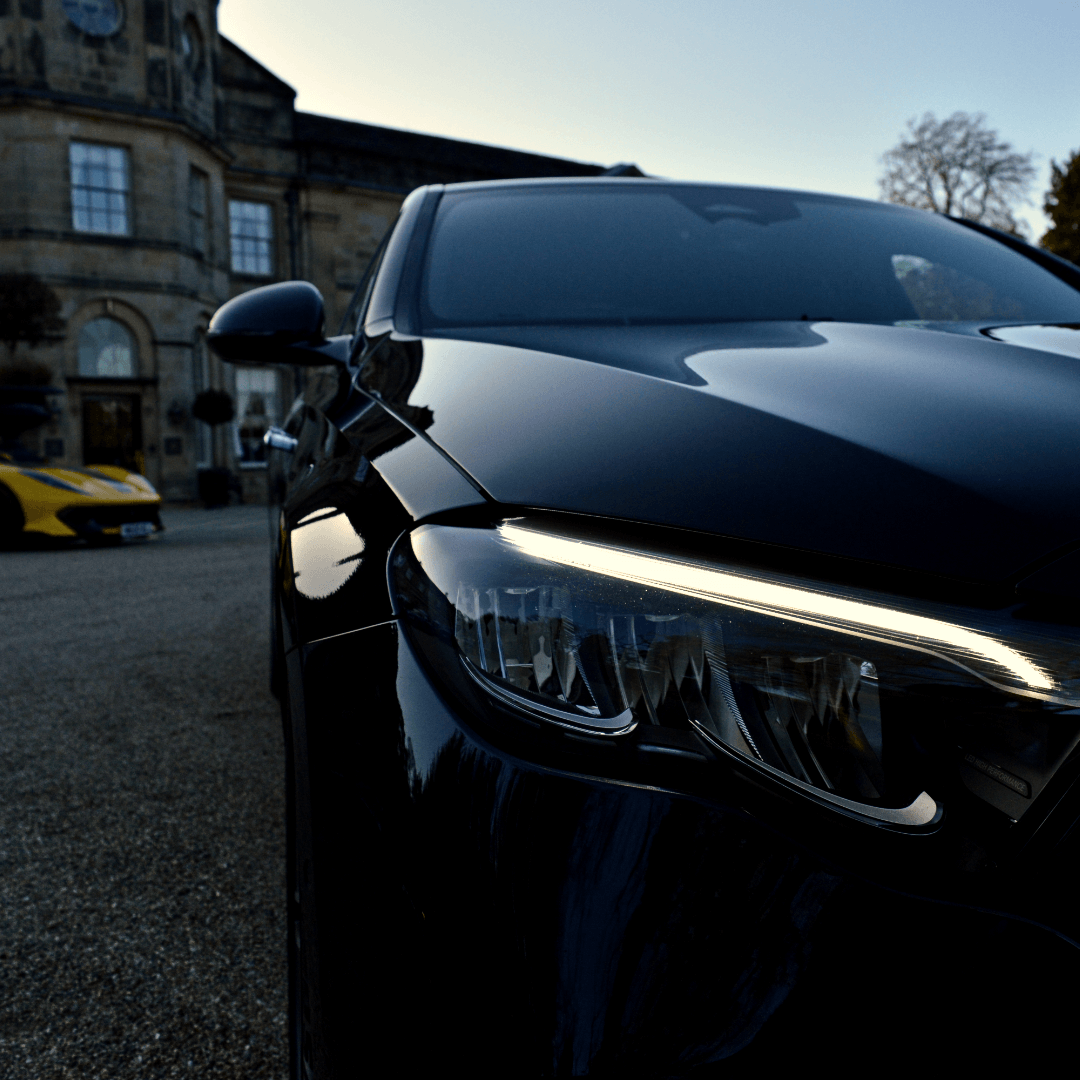 Closeup of a Mercedes-Benz E Class outside Grantley Hall - VIP Event Transport
